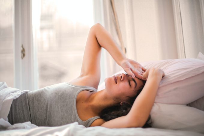 tired woman in bed