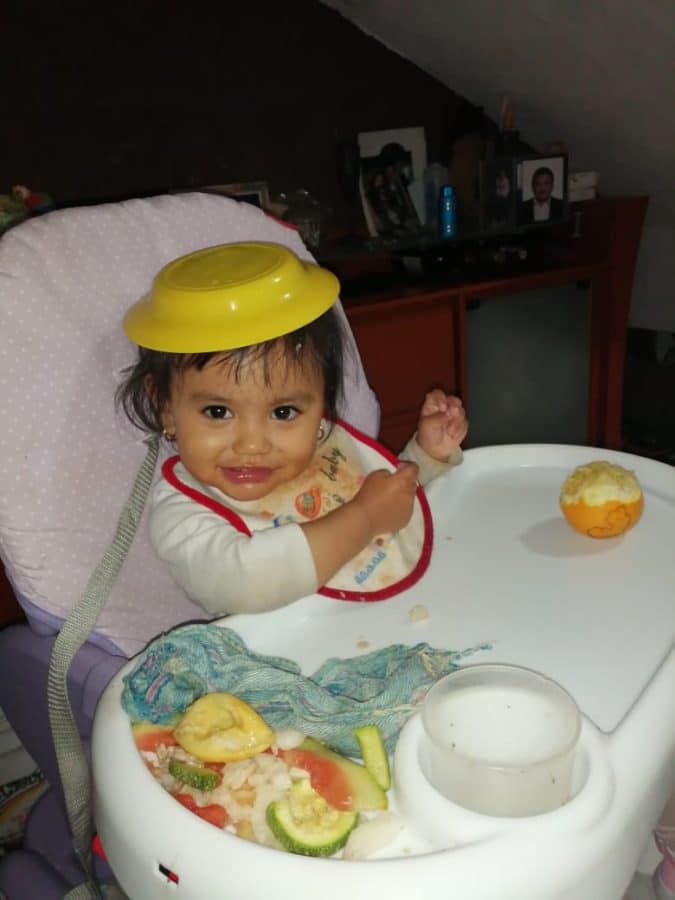 Claudia with her daughter Arleth playing