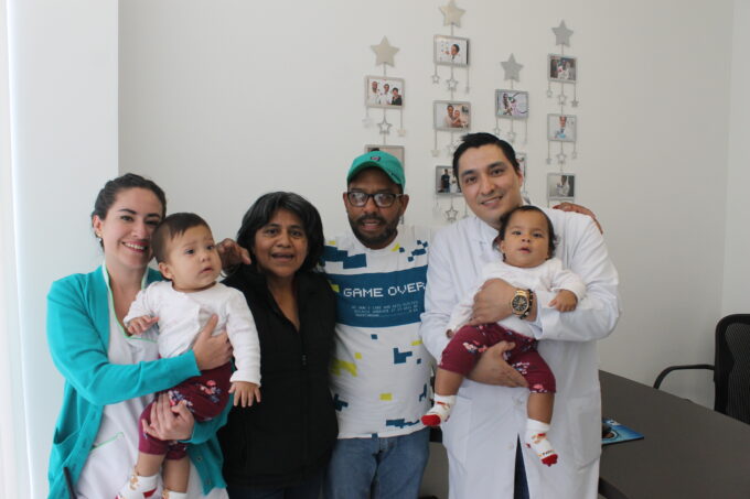 Dr. Israel with a couple of little ones he helped bring into the world via IVF