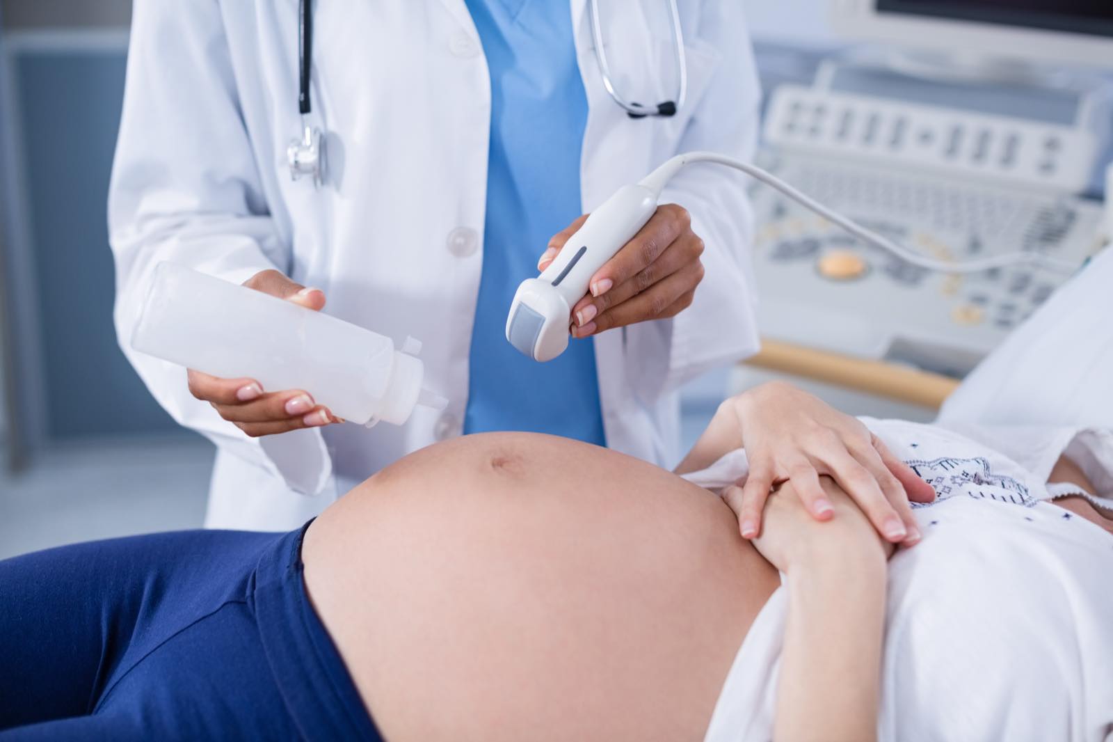Physician performing an obstetric ultrasound